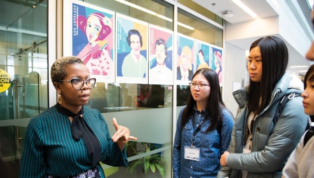 Woman talking to group of highschool girls