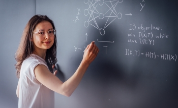 Anna Golubeva in front of a blackboard
