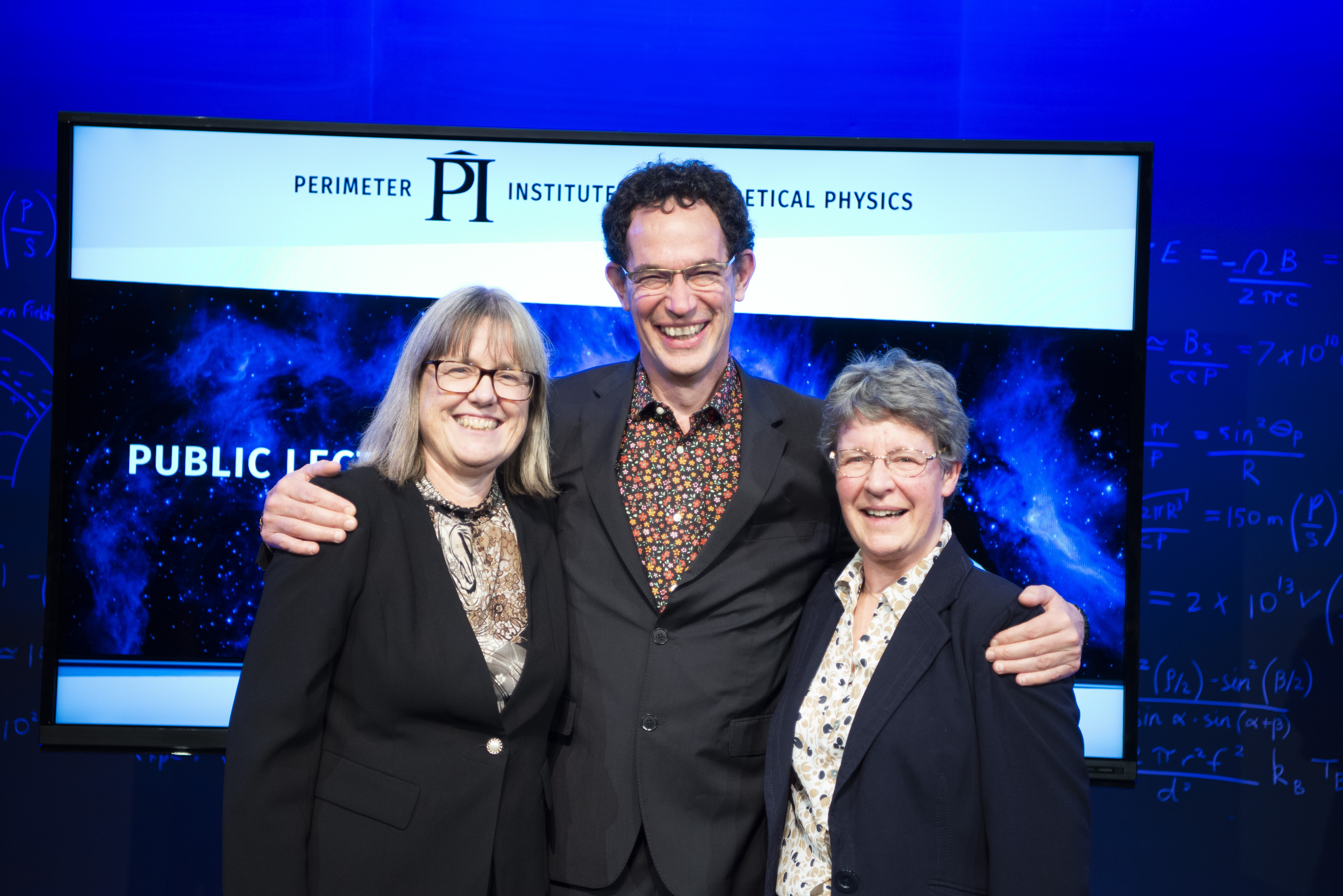 Donna Strickland, Neil Turok and Jocelyn Bell-Burnell standing together after Jocelyn's public lecture and the announcements of the new fellowships
