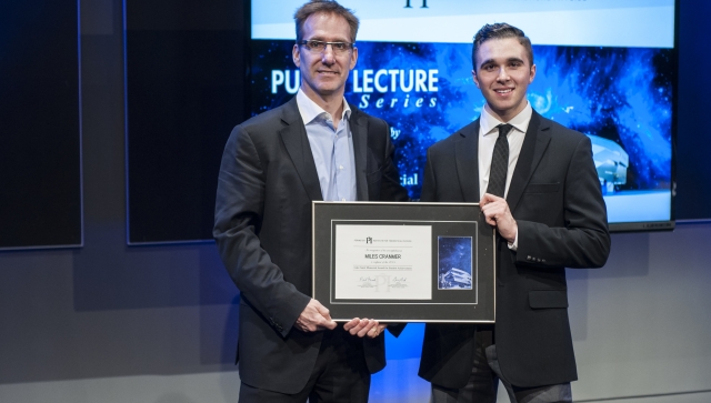 Miles Cranmer receiving the Luke Santi Memorial Award from Perimeter Director of Educational Outreach Greg Dick.