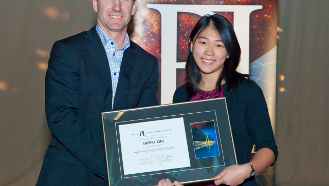 Sherry Chu receiving her Luke Santi Memorial award from Greg Dick, Perimeter's Director of Outreach